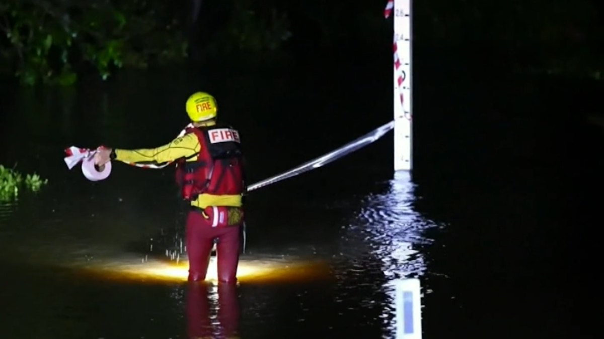 Young driver rescued in Queensland floodwaters