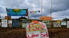 Metgasco will be paid $25 million to stop drilling for gas after fierce protests.