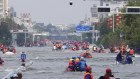 Expect more scenes like this. Rescuers use boats to evacuate people from a flooded area in Weihui in central China’s Henan province last month.