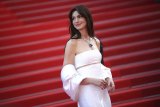 Anne Hathaway poses for photographers upon arrival at the premiere of the film 'Armageddon Time' at the 75th international film festival, Cannes, southern France, Thursday, May 19, 2022. (Photo by Vianney Le Caer/Invision/AP)