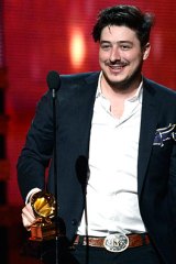Marcus Mumford of Mumford & Sons accepts the Grammy for album of the year for <i>Babel</i>.
