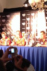 Captain and coaches of the combatants face the media after the grand final parade.