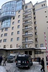 A special police investigators van is parked beside the rear entrance of the Ambassador hotel in St. Petersburg.