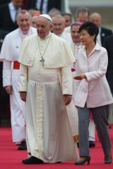South Korean President Park Geun-hye escorts Pope Francis following his arrival in Seongnam.