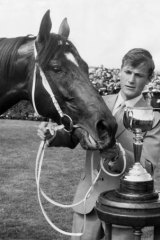 Les Samba, the strapper, with Rain Lover after winning the 1969 Melbourne Cup.