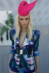Andrej Pejic wears his back-up Kerrie Stanley hat after Irish milliner Philip Treacy and the VRC objected to him wearing a Princess Beatrice tribute hat.