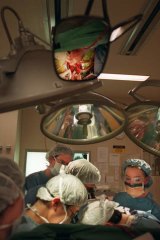 Doctors perform a heart transplant.
