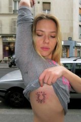Celebrity ink: Scarlett Johansson shows off her Fuzi tattoo.