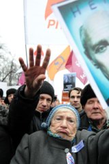 Russian opposition activists protest against Vladimir Putin.