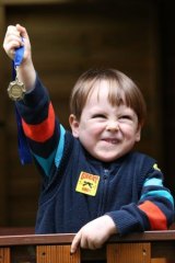 Angus Bianco, 3, from Rosebud Cottage, Rozelle,  holds up a medal the children recieve when they have finished their course. 