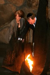 Julia Gillard and Peter Costello rekindle the eternal flame at Jerusalem's Yad Vashem Holocaust museum. Picture: Gali Tibbon.