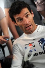 Mark Webber talks to the media at Le Mans.