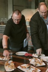 Ian Curley and Paul Wilson sample the roast chicken.