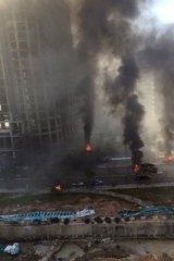 Shattered: Palls of smoke rise from the scene of the attack, which occurred in a part of downtown Beirut some Lebanese saw as a symbol of the country's rebirth.