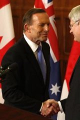 Soulmates: Prime Minister Tony Abbott shakes hands with Canadian Prime Minister Stephen Harper. 