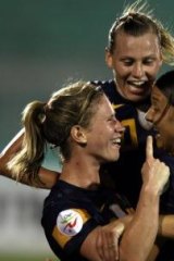 Elise Kellond-Knight (left) celebrates with her teammates after scoring the winning goal against South Korea in the semi-final.