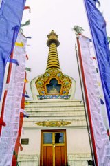 To the heavens … a Buddhist temple surrounded by prayer flags.