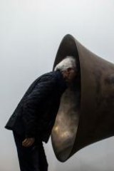 A visitor peers into US artist John Baldessari's <i>Beethoven's Trumpet (With Ear) Opus # 133</i> at this year's Art Basel fair in Hong Kong.