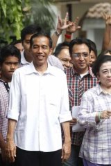 No walk in the park: Jokowi with former Indonesian president Megawati Sukarnoputri in 2012. His support has recently dipped, although he remains the favourite to win the presidency.