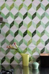 Tai Snaith's handpainted tiles for the family house designed by her partner, architect Simon Knott.