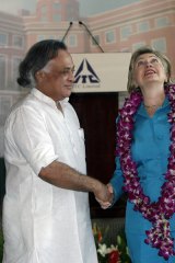 US Secretary of State Hillary Clinton shakes hands with Indian Minister of State for Environment and Forests Jairam Ramesh during a conference on climate change in Gurgaon, in the northern Indian state of Haryana.
