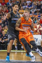 Guarded: Cairns import Scottie Wilbekin rounds New Zealand's defence.