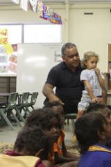 Watch and learn … Pearson with his son, Charlie, on his lap, at the Cape York Aboriginal Australian Academy, Aurukun campus, in 2010.