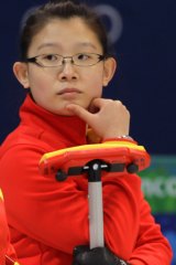 China's "Betty" Bingyu Wang discusses strategy in a match against Great Britain during round robin session of the women's curling at the 2010 Olympics in Vancouver.
