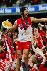 Celebrating the 2005 grand final victory in his now famous headgear.