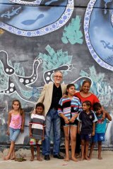 Pen power: Cuban ambassador Pedro Monzon and Cuban teacher Lucy Nunez with Aboriginal children in Bourke.