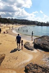 Awash with fortune: People enjoying the good weather at Balmoral Beach.