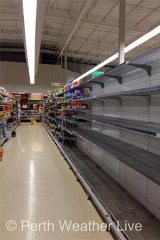 Empty supermarket shelves in Port Hedland as residents stock up on water ahead of the arrival of cyclone Rusty.