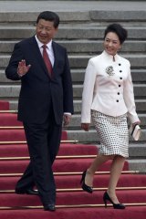 Fighting for frugality: Xi Jinping and his wife Peng Liyuan.
