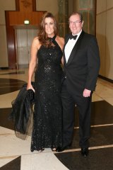 Peta Credlin, chief of staff to the Prime Minister, and her husband Brian Loughnane, federal director of the Liberal Party, arrive for the Midwinter Ball at Parliament House in Canberra.