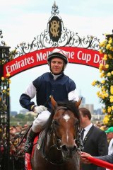 First past the post ... Brett Prebble riding Green Moon celebrates winning the 2012 Melbourne Cup.