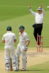 Six more ... Michael Clarke (L) looks on with Michael Hussey after hitting another six  off Imran Tahir.