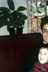 Stephen Crafti with his son in the 1980s in front of the Drysdale curtains in their home.