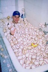 Zack Hample with his collection in 1999.