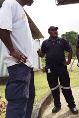 G4S contractors block access to the morgue where slain detainee Reza Barati’s body was held on Manus Island.