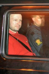 Bomb and terror suspect Anders Behring Breivik leaves the courthouse in a police car in Oslo after the hearing to decide his further detention.