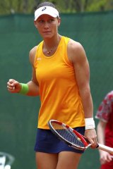 Samantha Stosur clenches her fist after defeating Stefanie Voegele of Switzerland on day three of the Fed Cup world group playoffs in Chiasso, Switzerland, on Monday.
