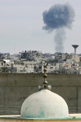 Smoke rises after an Israeli air strike in the Gaza Strip, near the Egyptian border.
