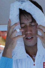 Heat is on: Kei Nishikori cools down with an ice pack.