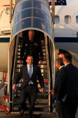 Prime Minister Tony Abbott arrive in the Netherlands to discuss the investigation into the downing of MH17.