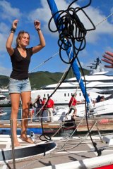 Dekker docks her yacht, Guppy, on the Caribbean island of St Martin on Saturday after ending her year-long solo voyage around the world.