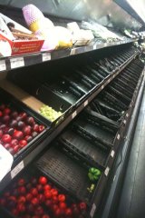 Brisbane's grocery stores have been largely stripped bare and face difficulty restocking.