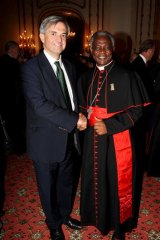 Early favourite ... Ghana's Cardinal Turkson, right.