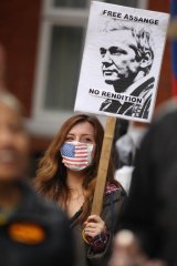 A supporter of Julian Assange protests outside the Ecuadorian embassy in London.