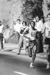 Rob De Castella passes Tanzania's Ikangaa on the way to victory in the men's marathon at the 1982 Brisbane Commonwealth Games.