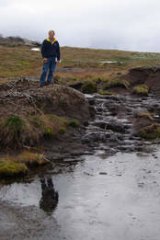 Protective detail … former Labor environment minister John Thwaites beside a damaged peat bed, before his government banned alpine grazing in 2005.